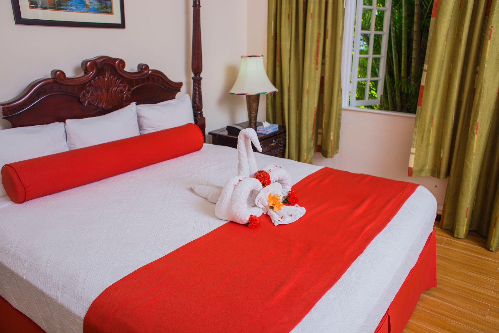 Standard Room with a mahogany four-poster king bed